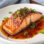 Brushing salmon with sweet chilli sauce